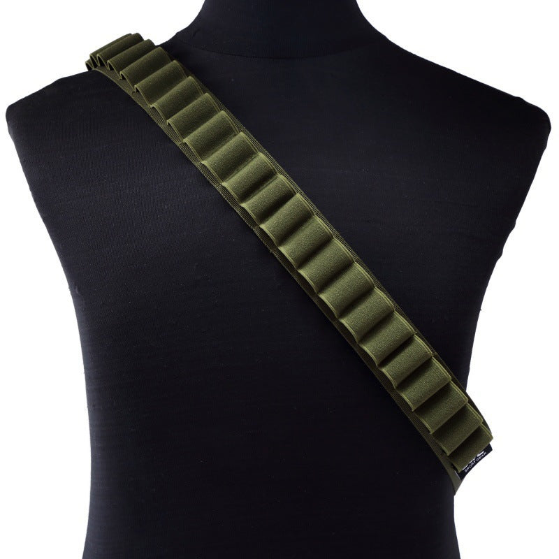 Olive green shotgun shell bandolier with 25 elastic loops, displayed diagonally across a black mannequin