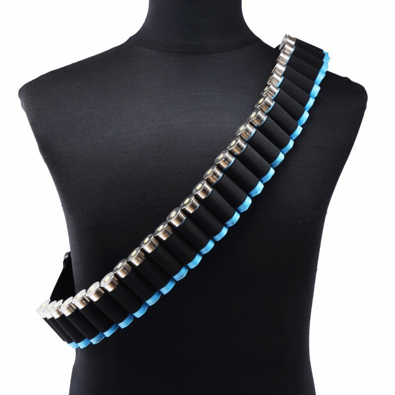 Black shotgun shell bandolier with blue trim, holding black and silver shotgun shells, diagonally across a black mannequin