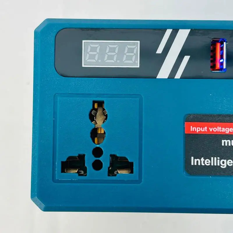 Close-up of blue and black power inverter showing multi-socket AC outlet, digital display, USB-A and USB-C ports